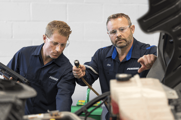 Maintenance technicians working on a truck