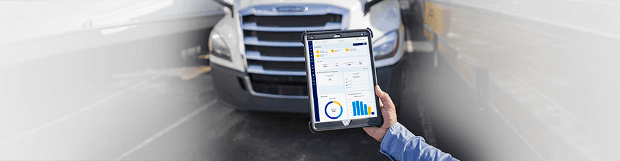 Penske sales rep holding a tablet with Fleet Insight displayed